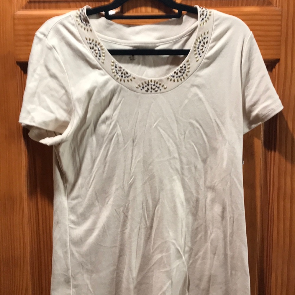 Short sleeved tan/beige shirt.